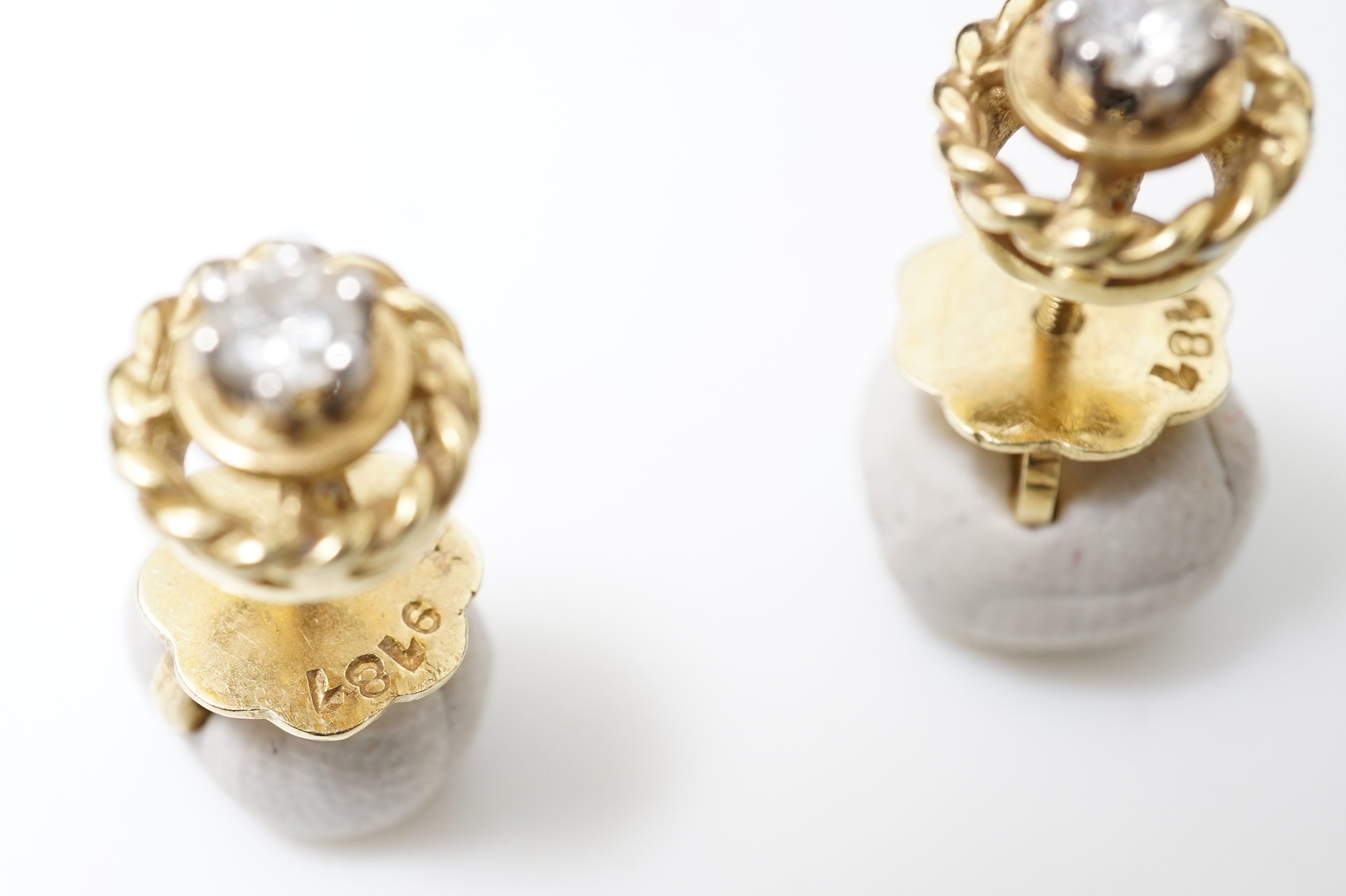 A pair of diamond stud earrings